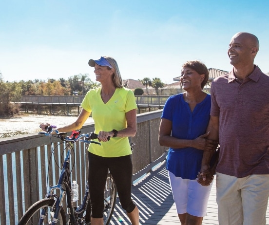 people walking accross a bridge