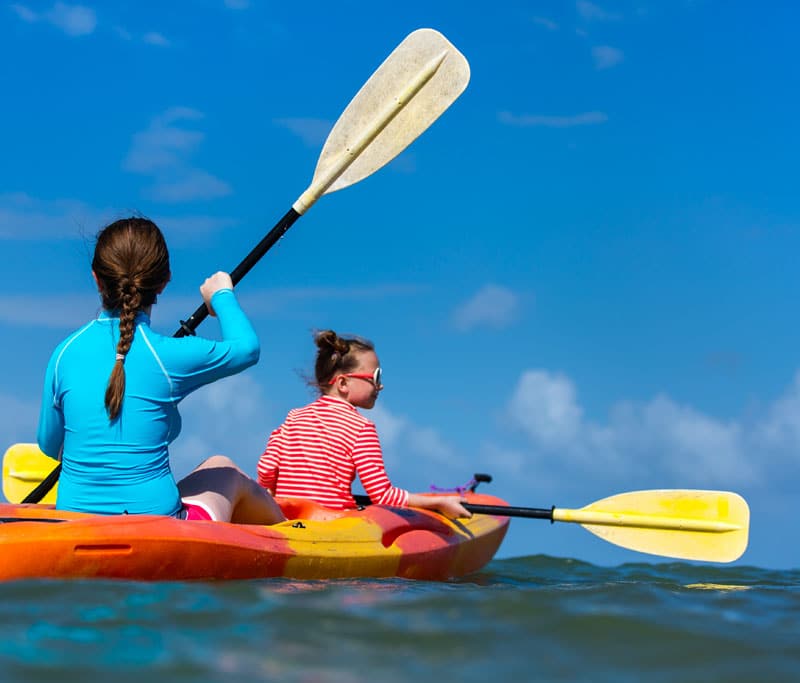 Two people in a kayak on the water together