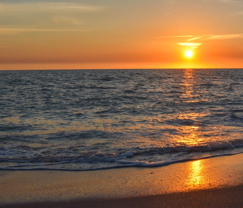 A view of the beachat sunset