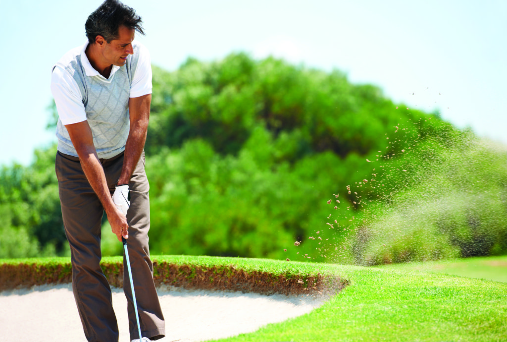 Golfer in sandtrap