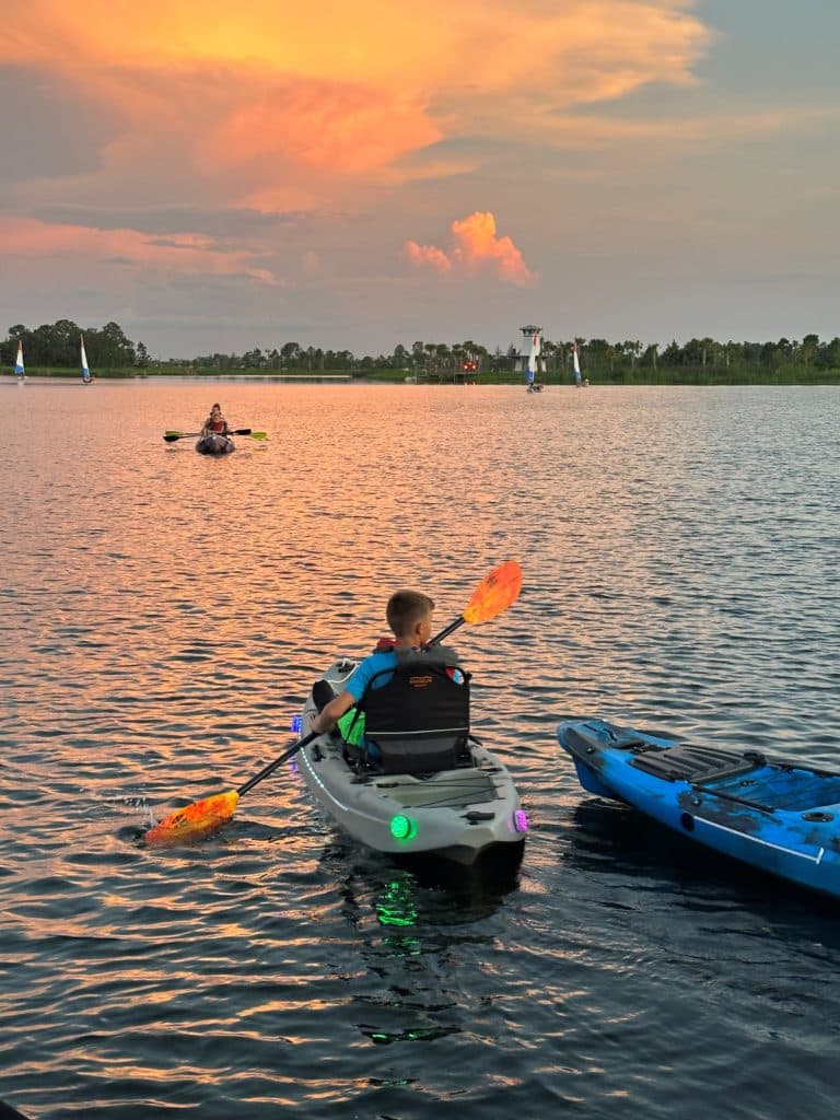 A person in a lake kayaking