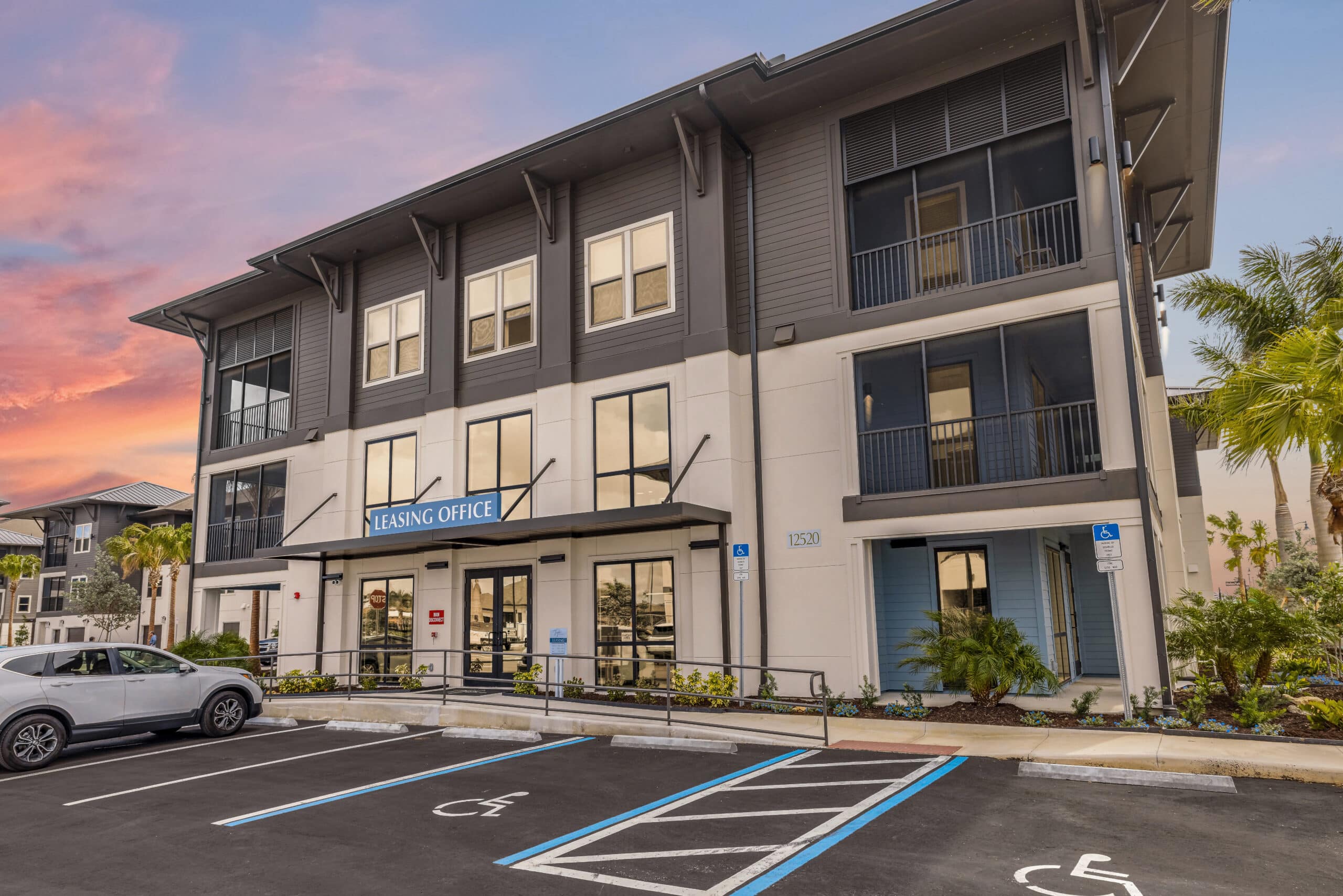 The entrance of Tropia at Wellen Park with handicap parking in front of the door