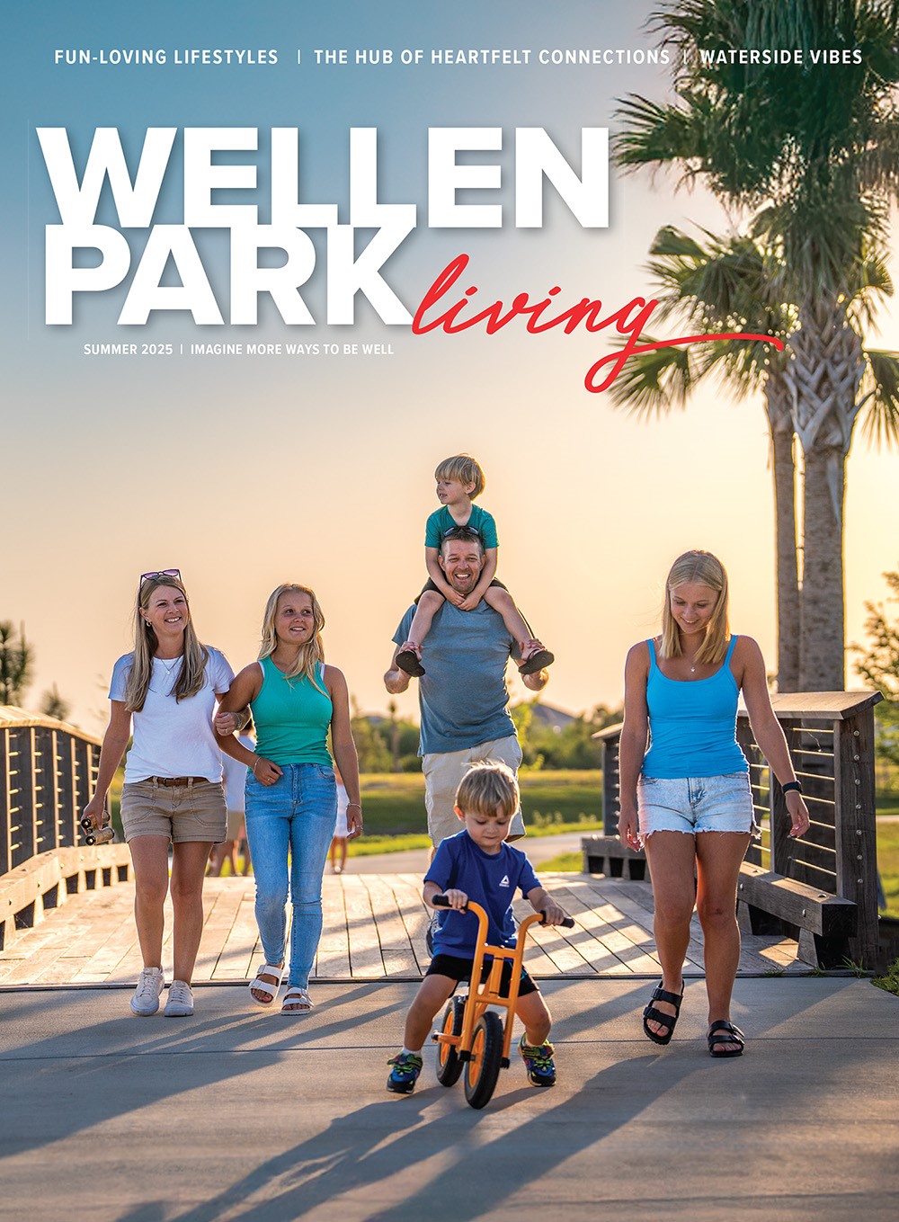 Cover of Wellen Park Living magazine showing a family walking on a boardwalk at sunset