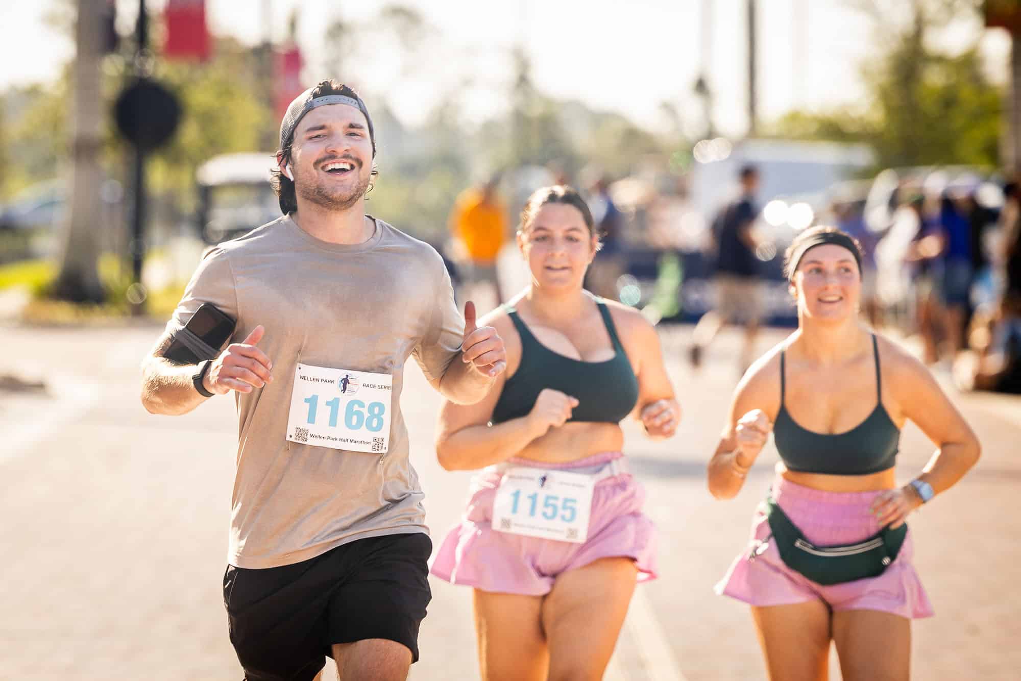 Two women and a man running in the Wellen Park Half Marathon